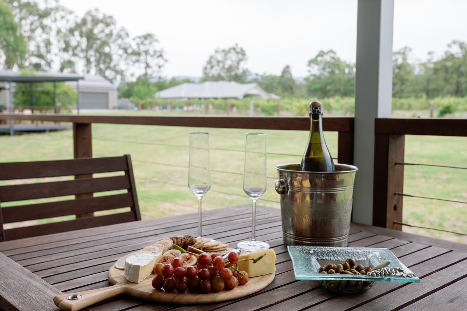 Cheese board and sparkling wine on the cottage deck at 27 Rows on Hermitage, Pokolbin, Hunter Valley