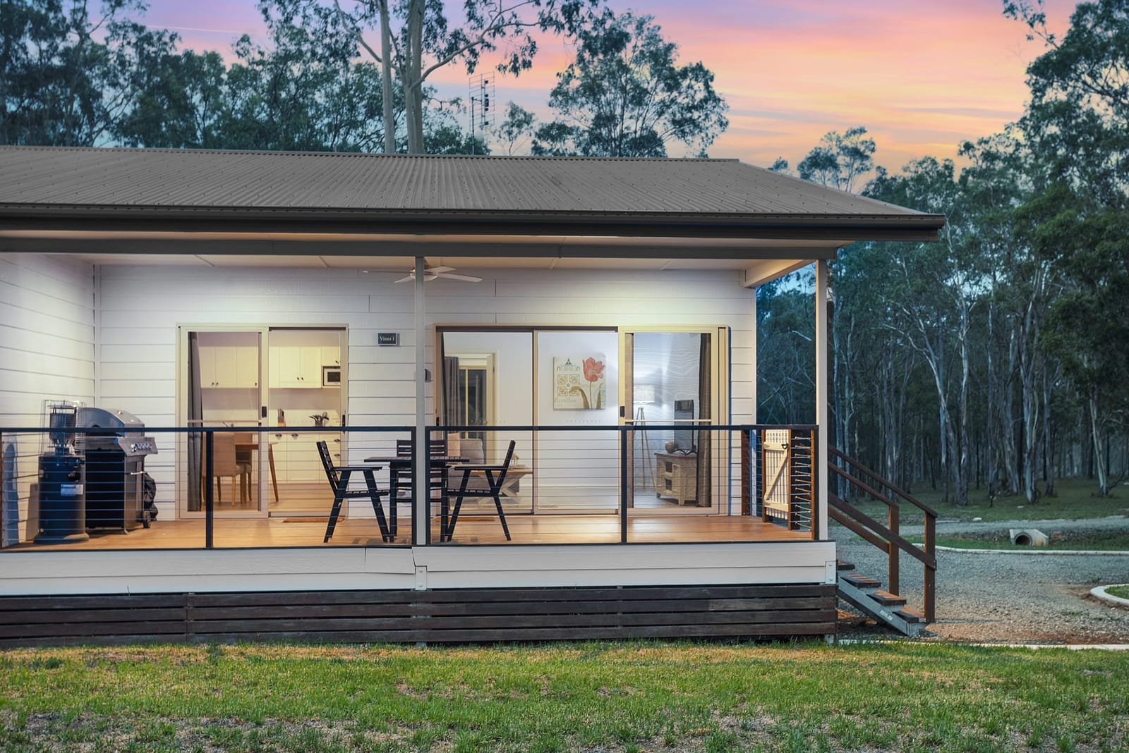 The Vines 1 cottage with its glass doors open onto the deck