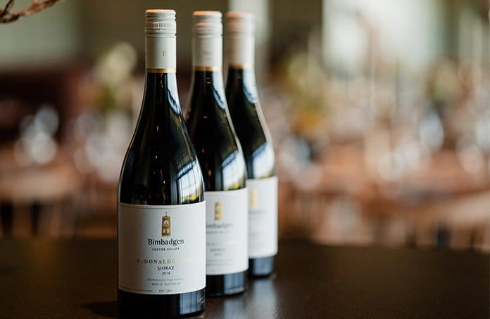 Three Bimbadgen Shiraz wine bottles with white labels