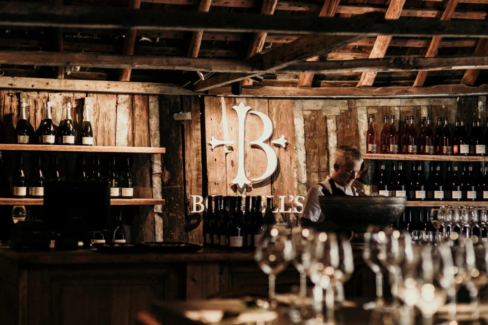 Historic wooden cellar door with wine bottles and signage at Boydell's, Morpeth, Hunter Valley