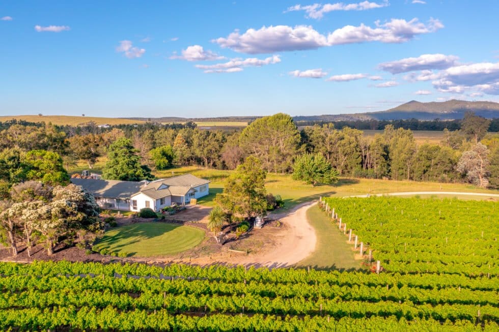 Aerial view of the farmhouse ringed by its own vineyard at Broke in the Vines, Broke, Hunter Valley