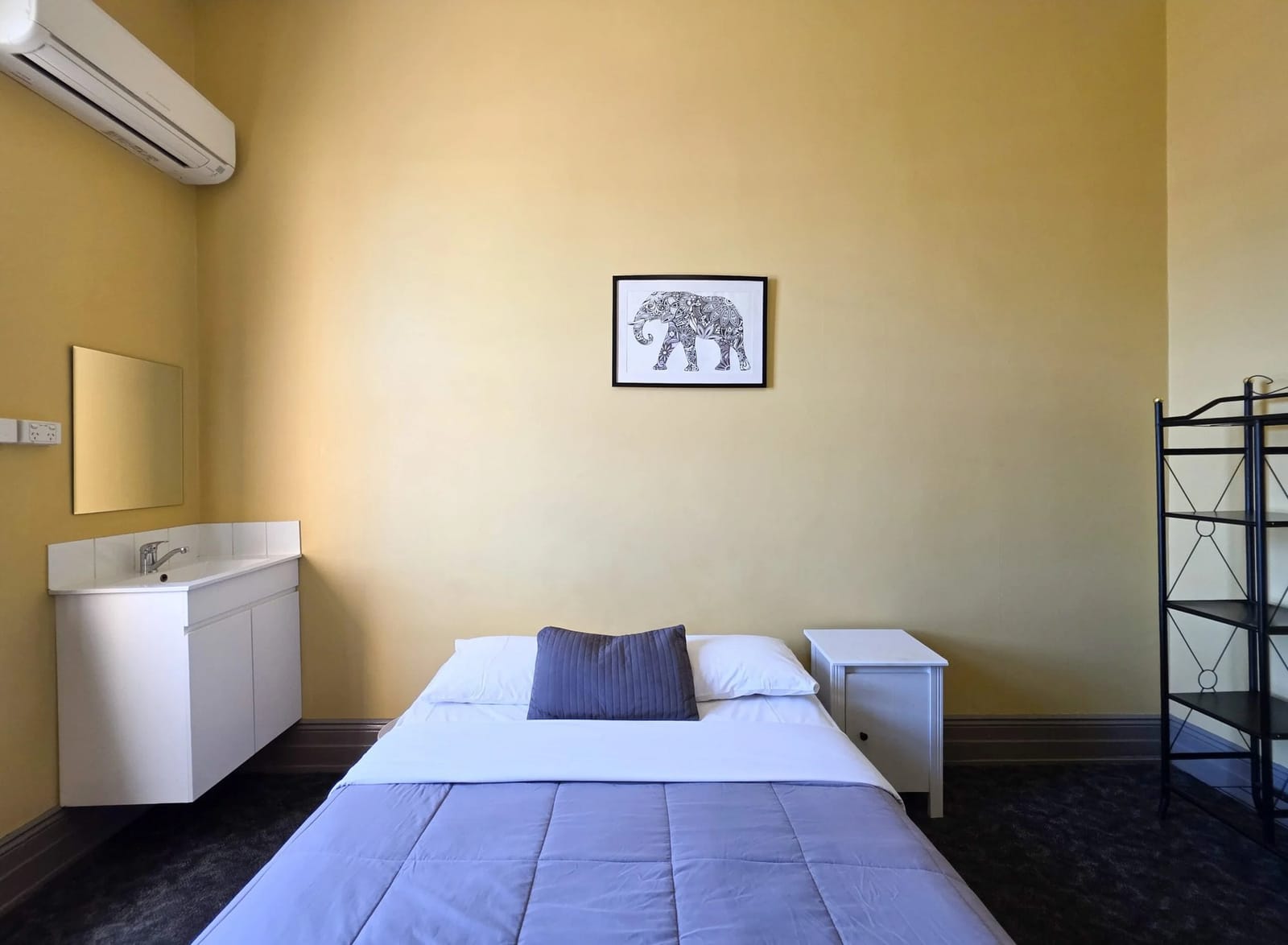 Double room with bed, wardrobe and ensuite vanity at Cessnock Hotel.