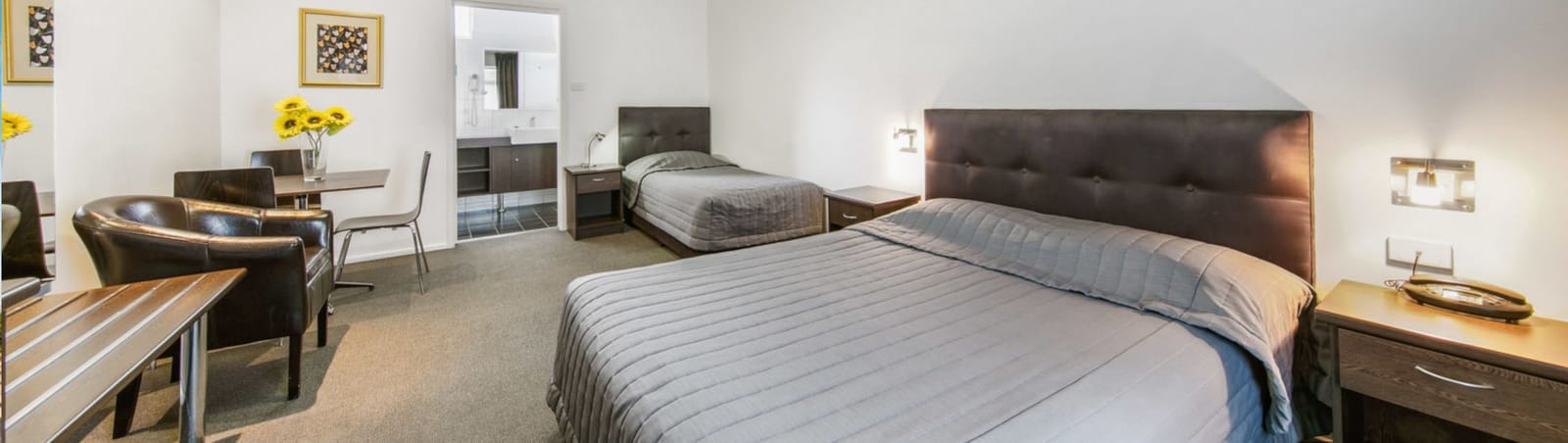 A queen motel room with ensuite bathroom