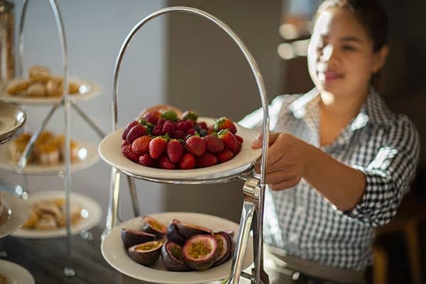 A tiered stand of berries and fruit at a breakfast buffet at Cypress Lakes Bistro & Bar.