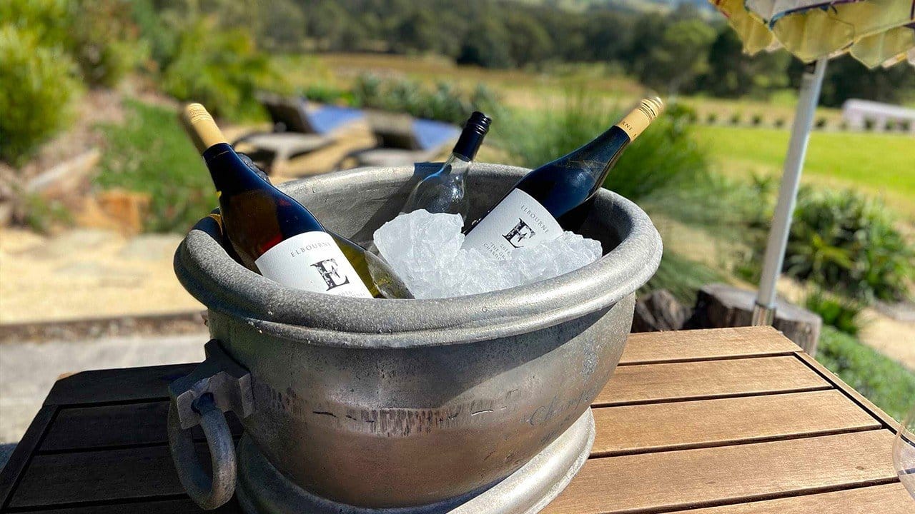 Wine bottles chilling in ice bucket with vineyard landscape view at Elbourne, Pokolbin, Hunter Valley