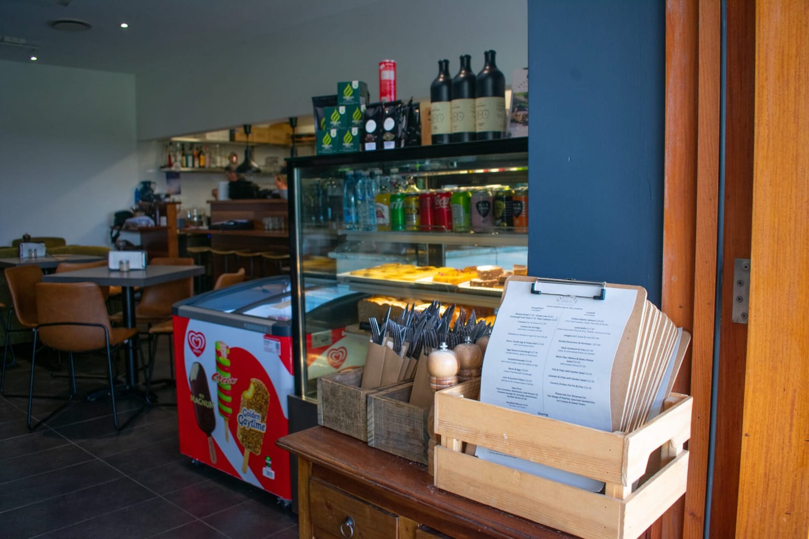 Elliotts at Oakvale dining room interior with tables, bar and the pastry display cabinet.