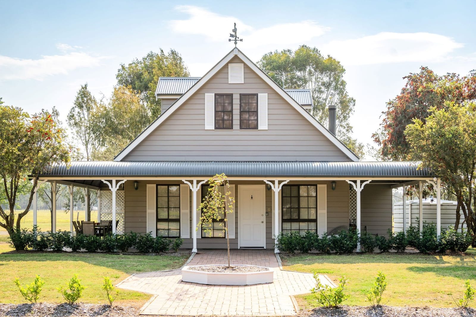 Charming farmhouse cottage with metal roof, wide porch and grounds at Emma's Cottage, Lovedale, Hunter Valley