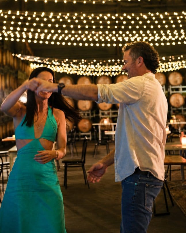 Dancing under fairy lights in the Barrel Room at Entwine