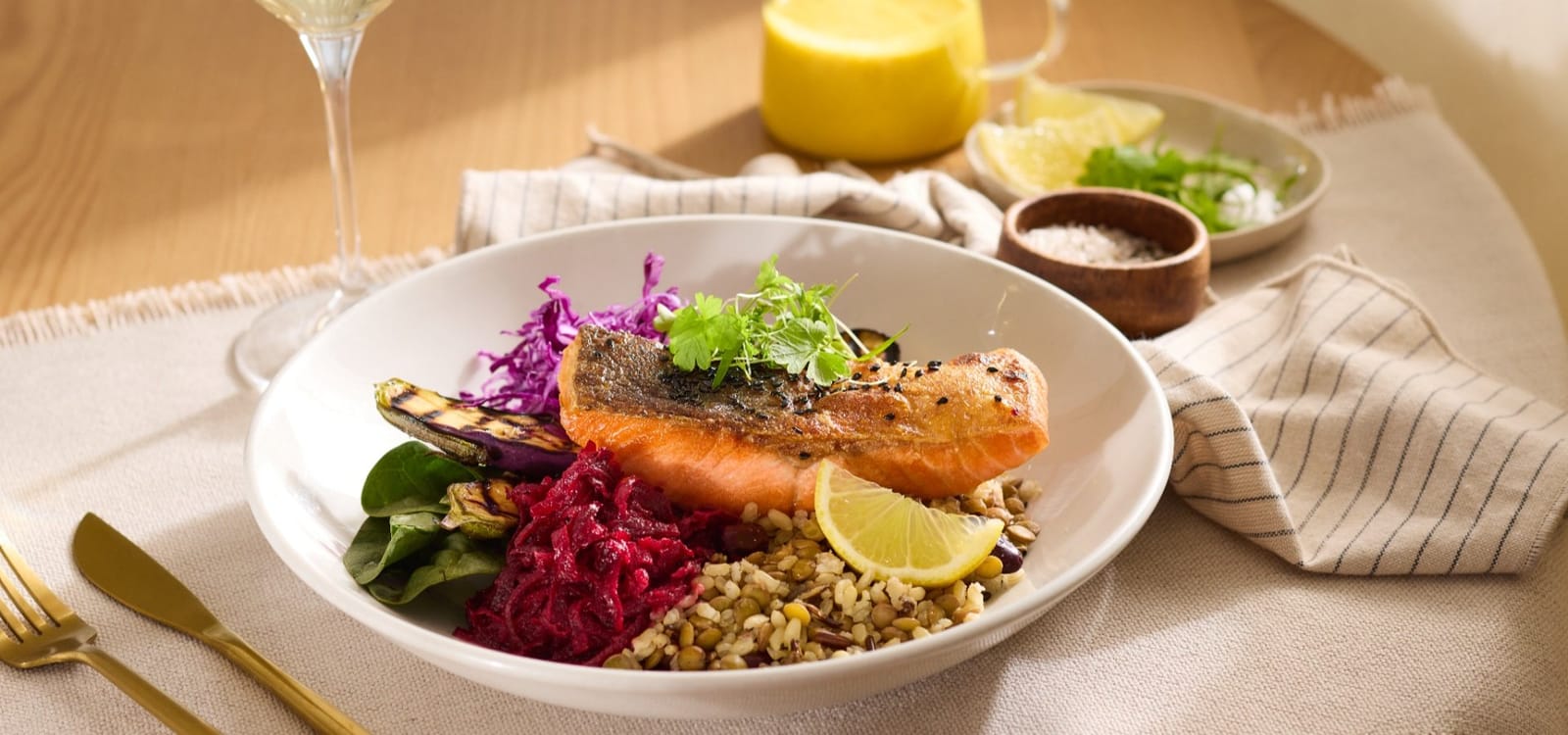 Plated seared salmon with grains, pickled cabbage and citrus at Fusion restaurant, Elysia Wellness Retreat.