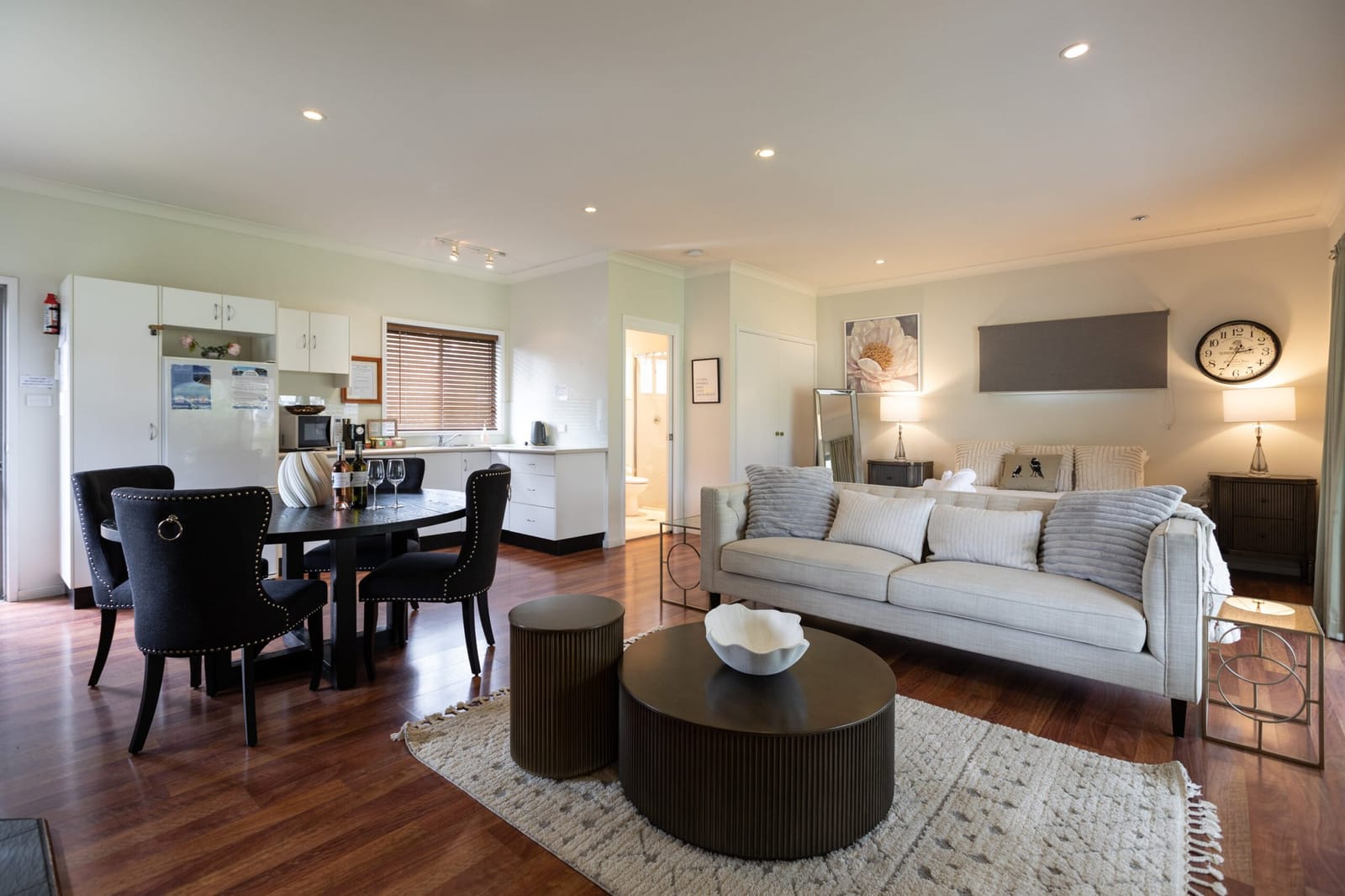 Apartment interior with open kitchen, dining table and living area
