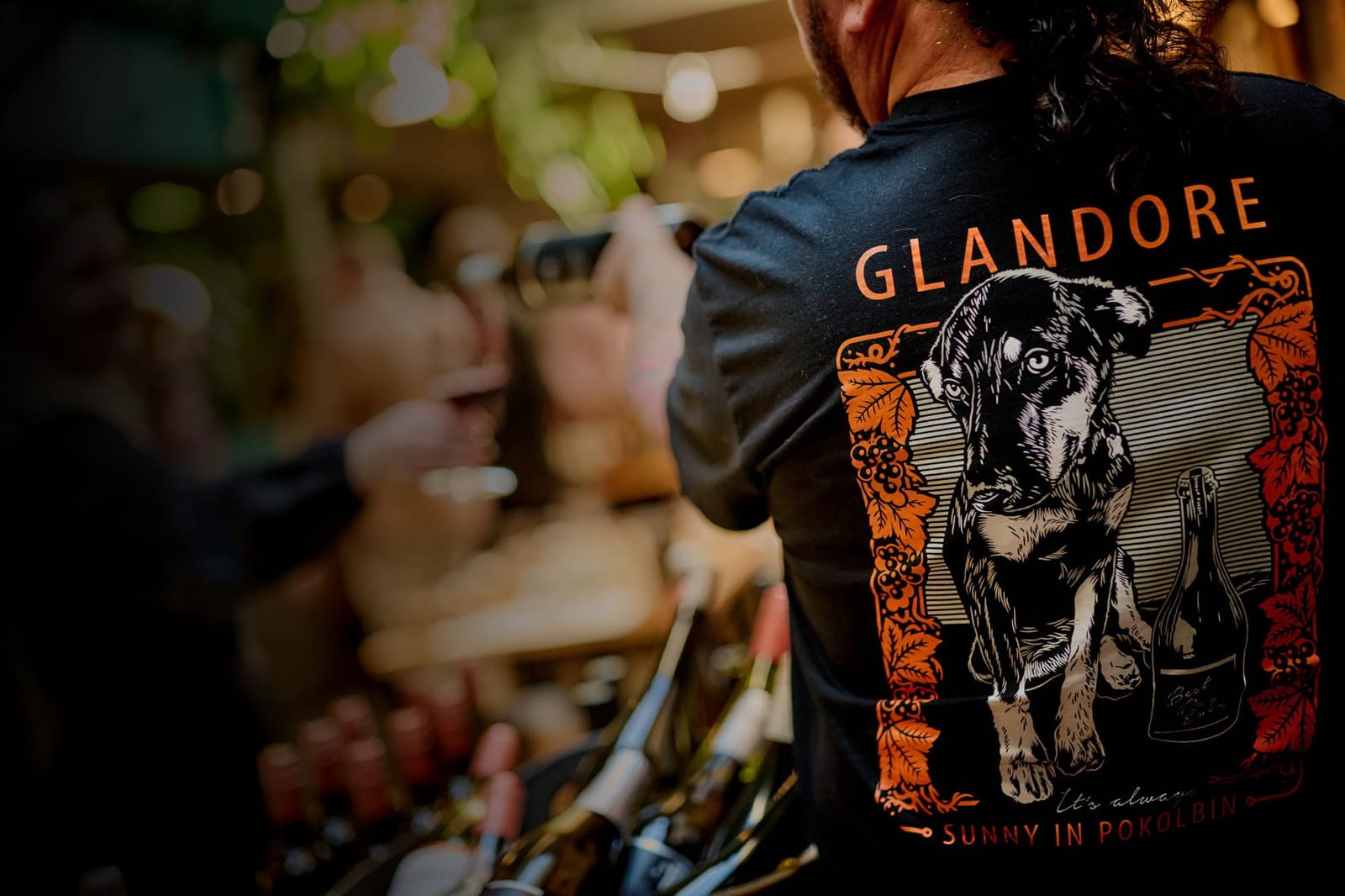 Staff member in branded Glandore shirt at the tasting room counter