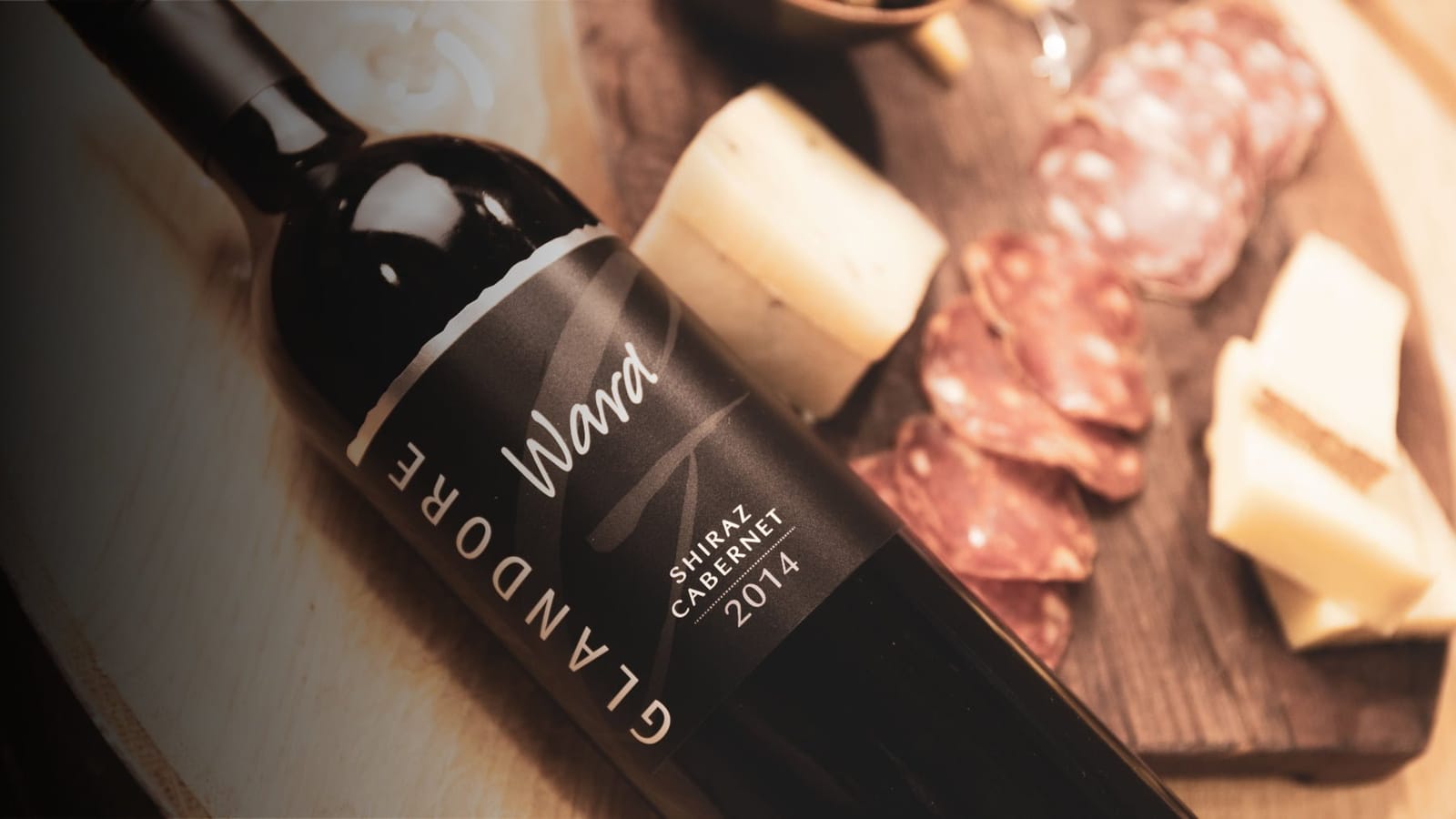 Glandore wine bottle with cured meat and cheese food pairing display