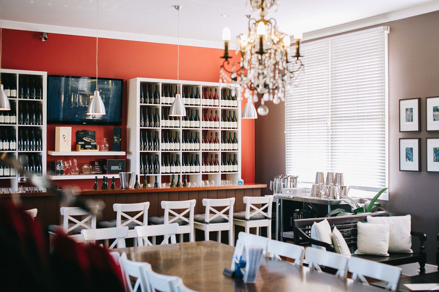 Tasting room interior with wine displays, counter seating and modern decor