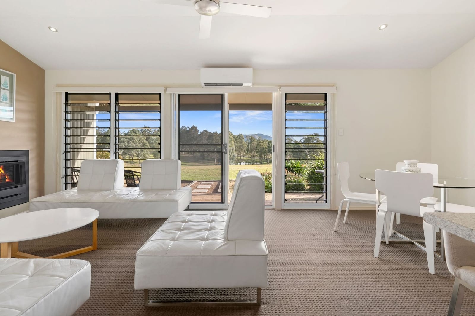 The living area of a two bedroom villa with its fireplace