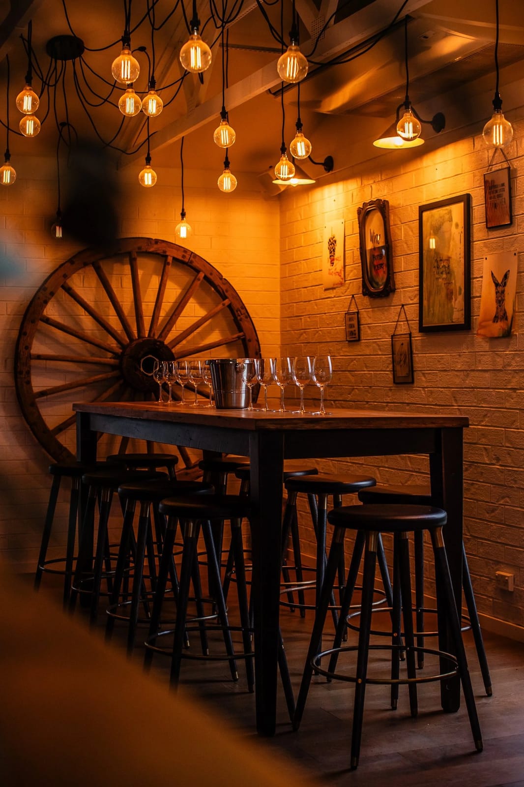 Tasting room with pendant lights, wooden wheel and wine display shelves at Harkham, Pokolbin, Hunter Valley