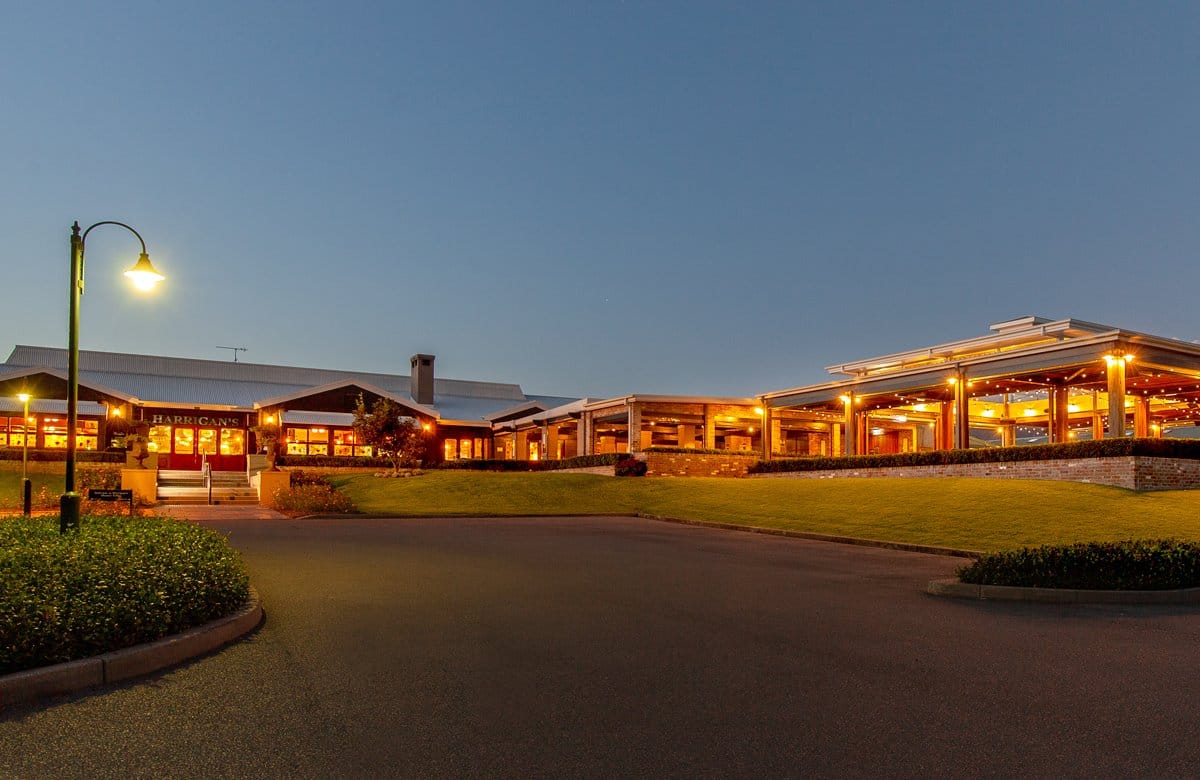The pub and its lit alfresco pavilion at dusk at Harrigan's, Pokolbin, Hunter Valley