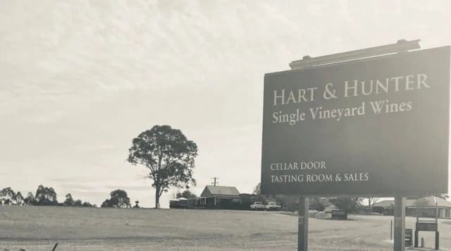 Winery entrance signage with building and open landscape at Hart & Hunter, Pokolbin, Hunter Valley