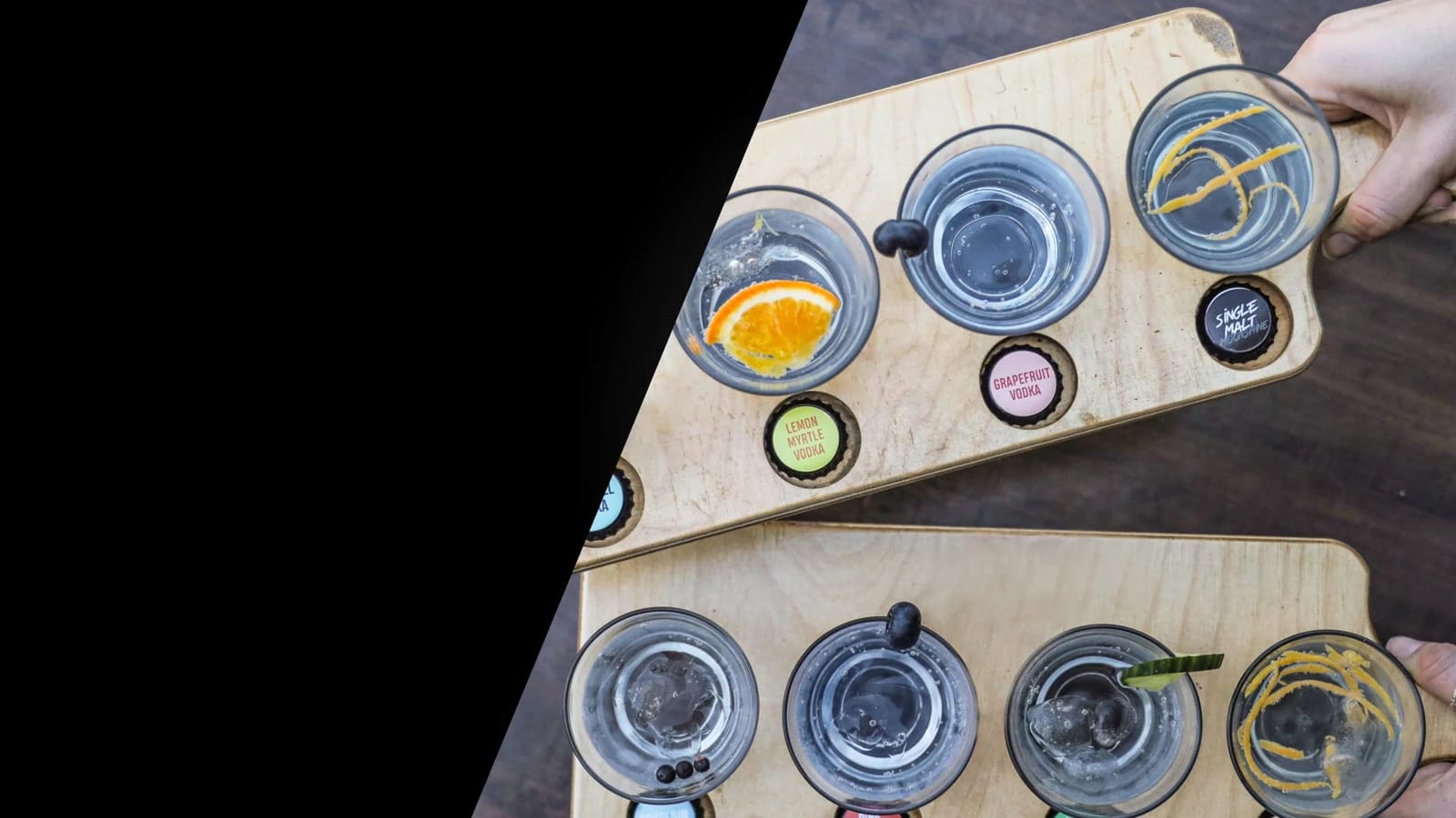 A tasting paddle of spirits including lemon myrtle vodka, grapefruit vodka and single malt whiskey at Hope Distillery