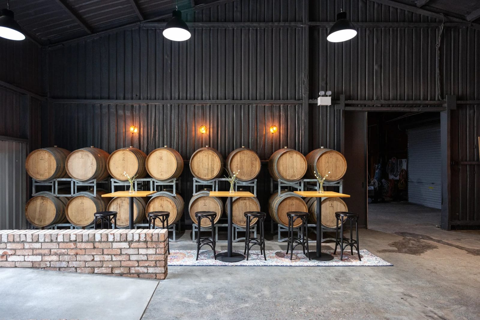 Oak barrels with dining tables under pendant lights at Horner, Pokolbin, Hunter Valley