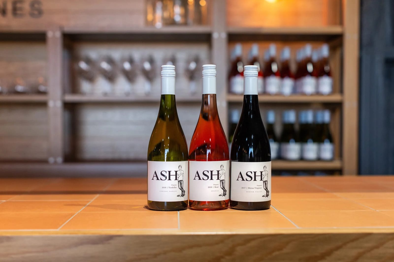 Three bottles of Ash wines, white, rosé and red varieties displayed