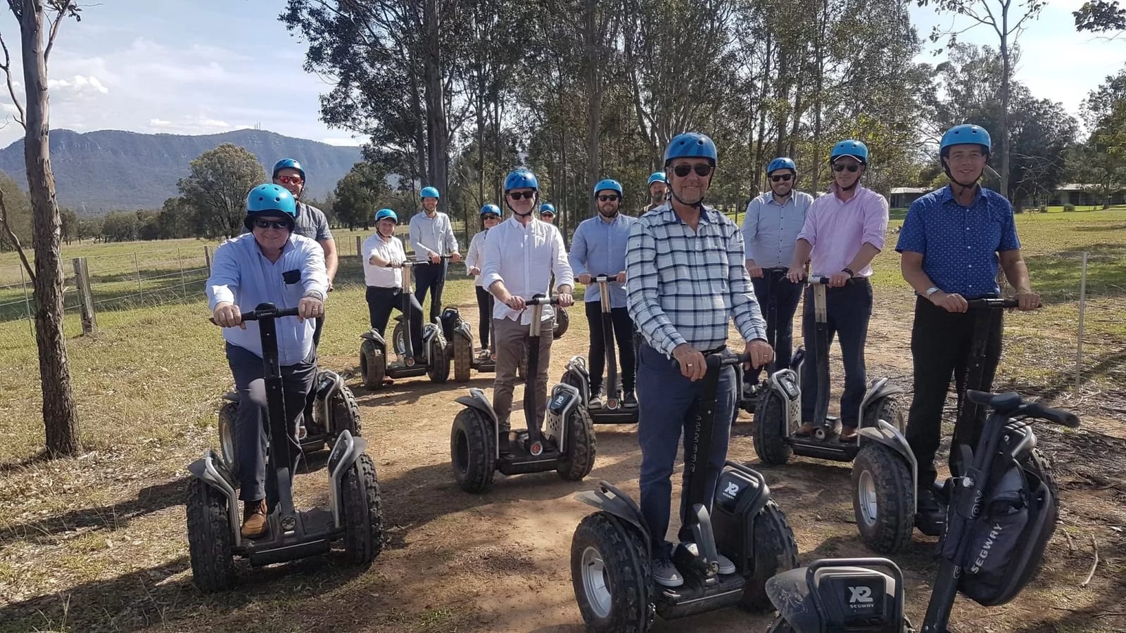 Segway tour group riding through a paddock at Hunter Farm & Adventure Centre, Pokolbin