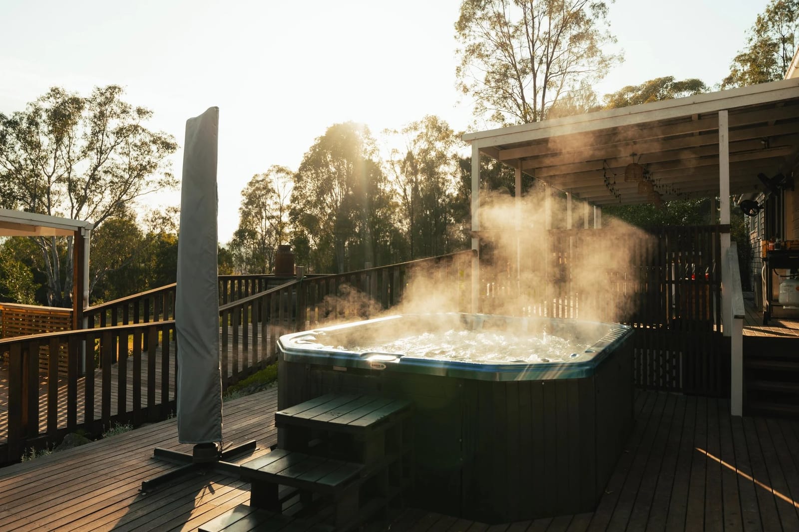 The outdoor jacuzzi steaming in the morning mist