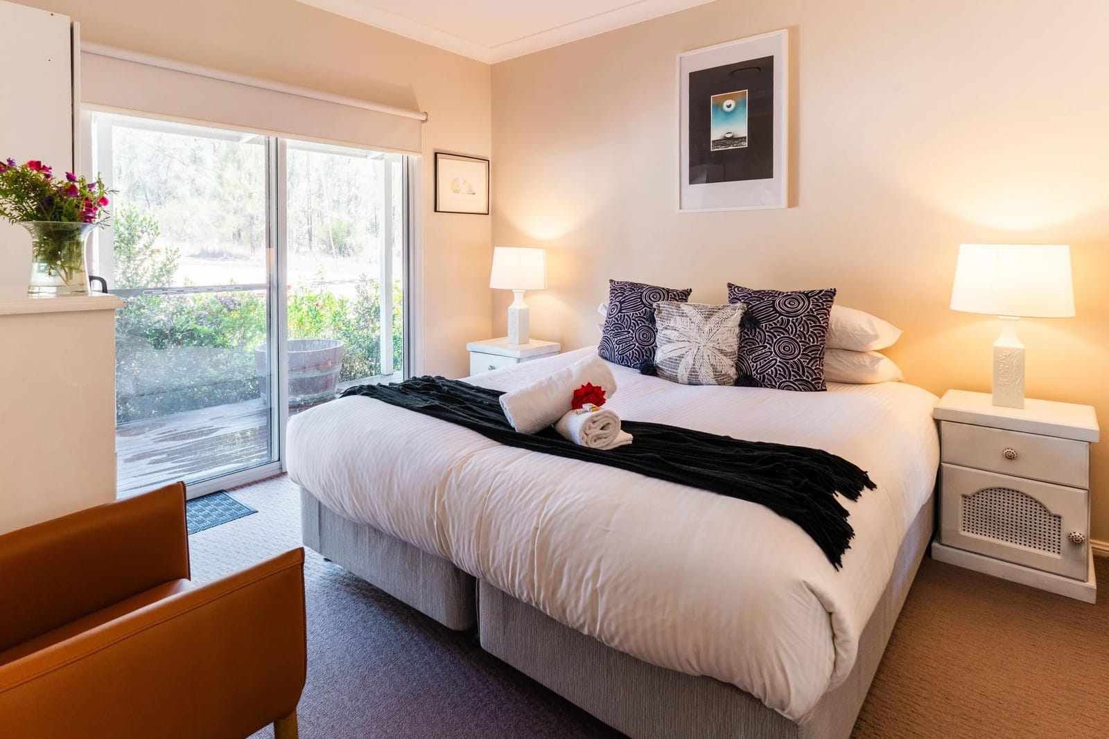 A bedroom made up with a king bed