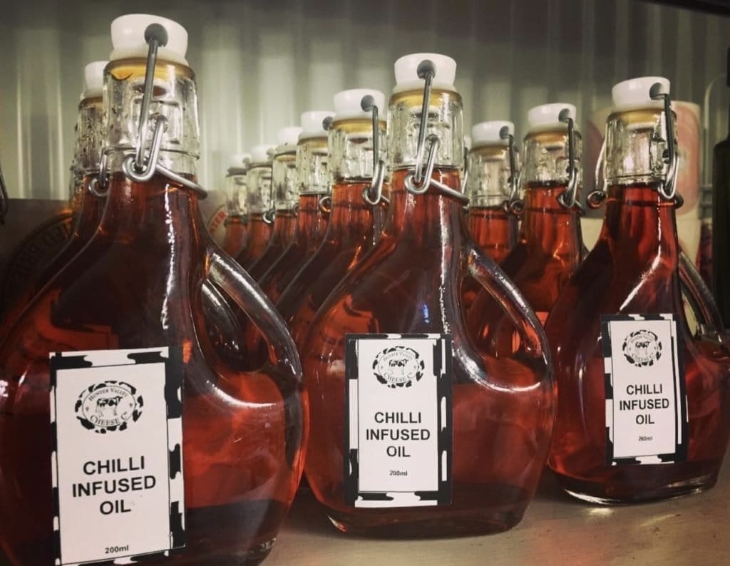 Multiple bottles of chilli infused oil with swing top metal caps