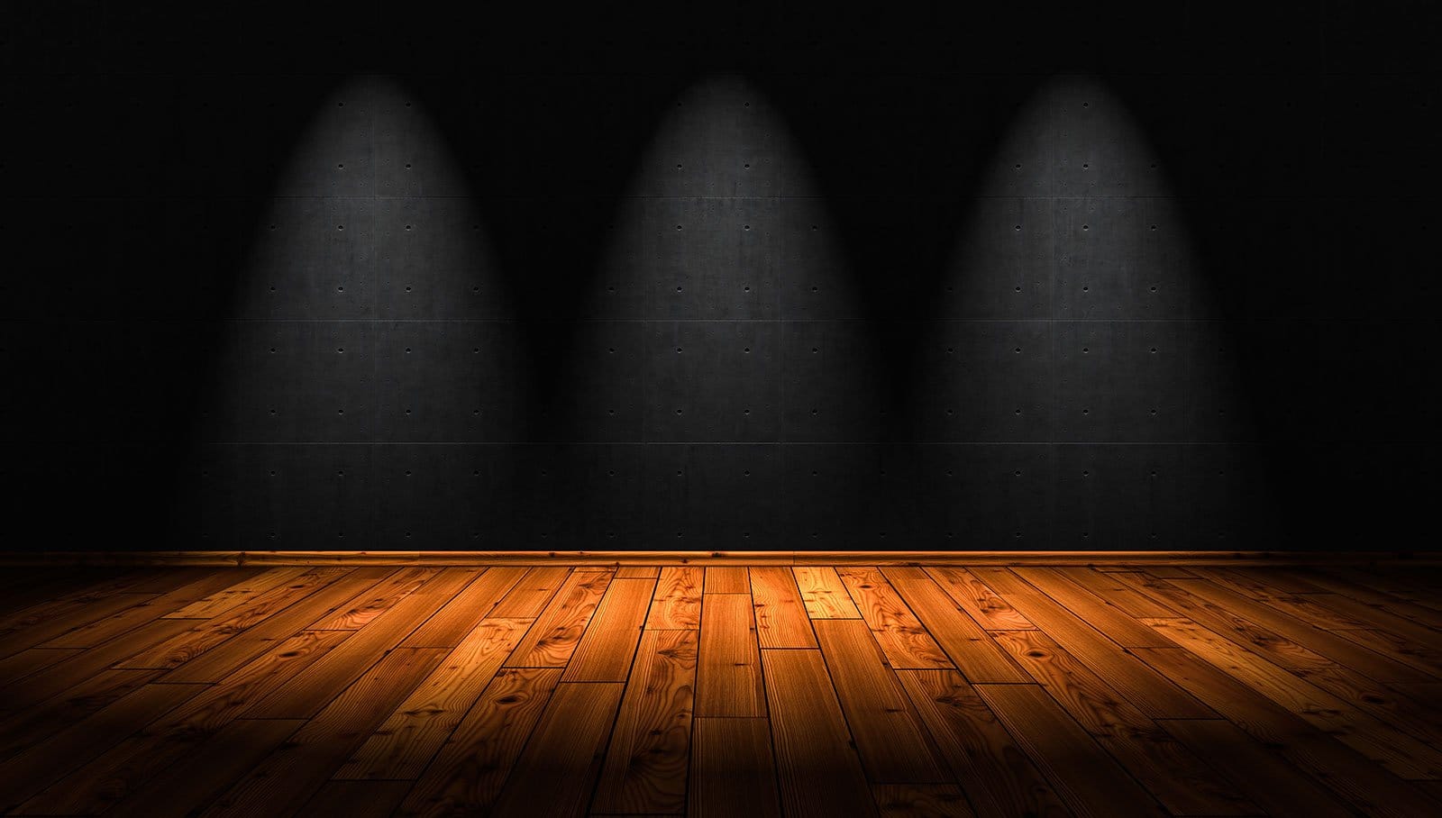 Polished wooden flooring in gallery space with overhead spotlighting