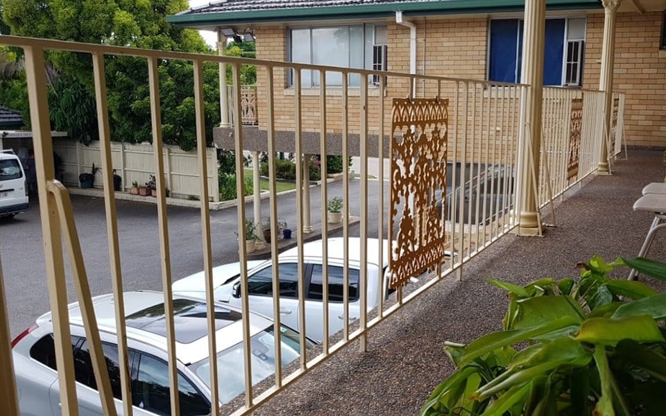 Front gate and guest car park at Hunter Valley Motel, Cessnock, viewed from the entrance.