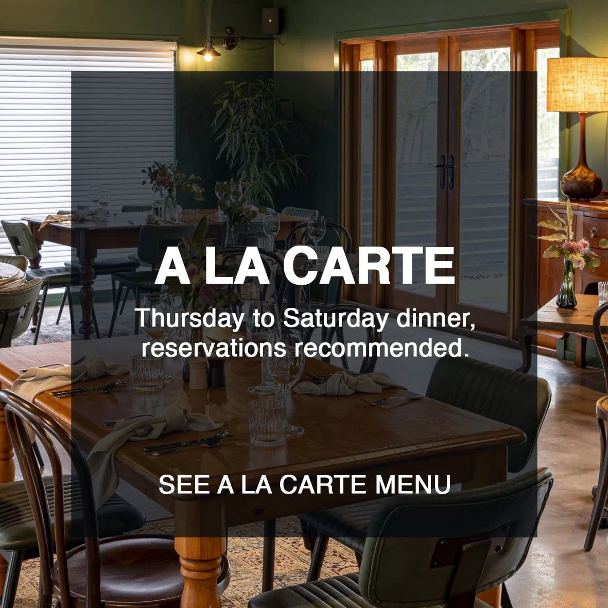 Restaurant dining room with tables set for service and modern decor