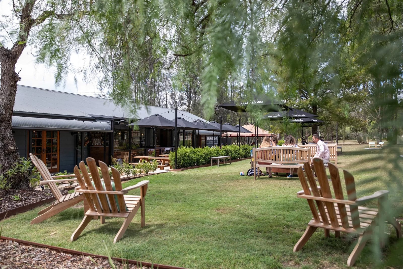 Adirondack seating under shaded trees at Jimmy Joans, Lovedale, Hunter Valley