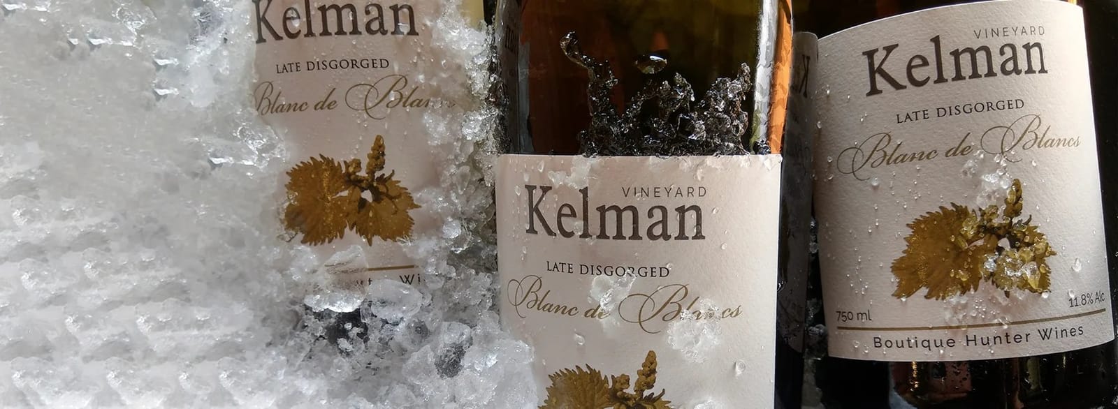 Kelman wine bottles chilled on ice displaying Late Disgorged Blanc de Blancs