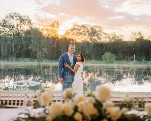 Couple beside pond at dusk at La Vigna Estate, Pokolbin, Hunter Valley