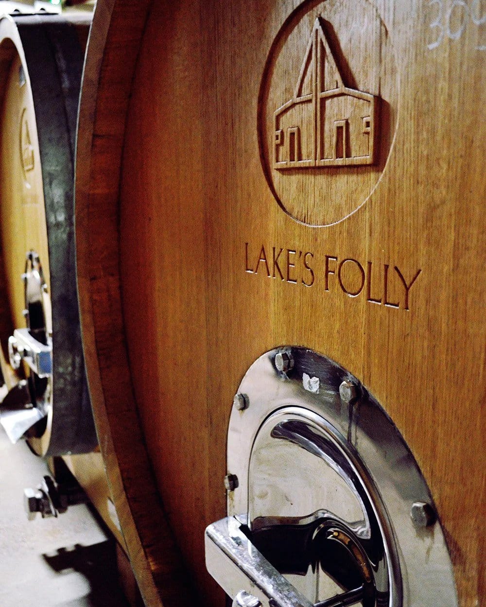 Wooden wine barrel with Lake's Folly logo carved into wooden stave