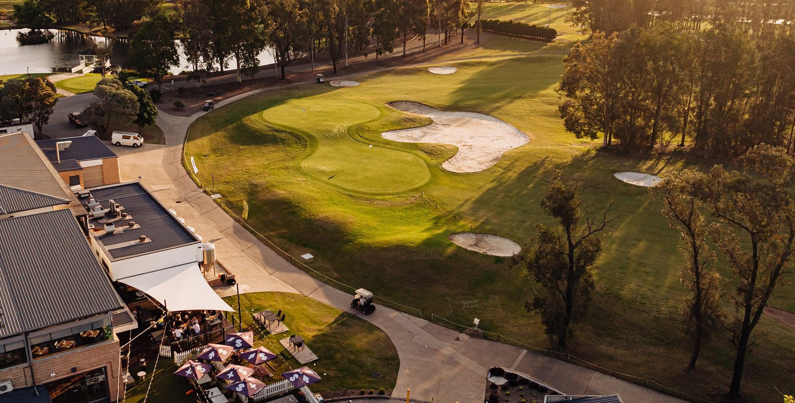 Brewbar terrace with umbrellas beside the golf course at Lovedale Brewbar, Lovedale, Hunter Valley