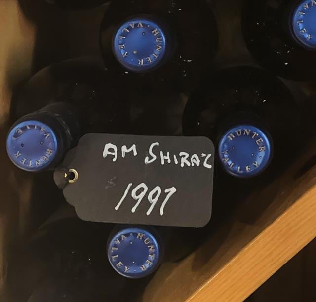 AM Shiraz wine bottles with 1997 vintage label and capsules