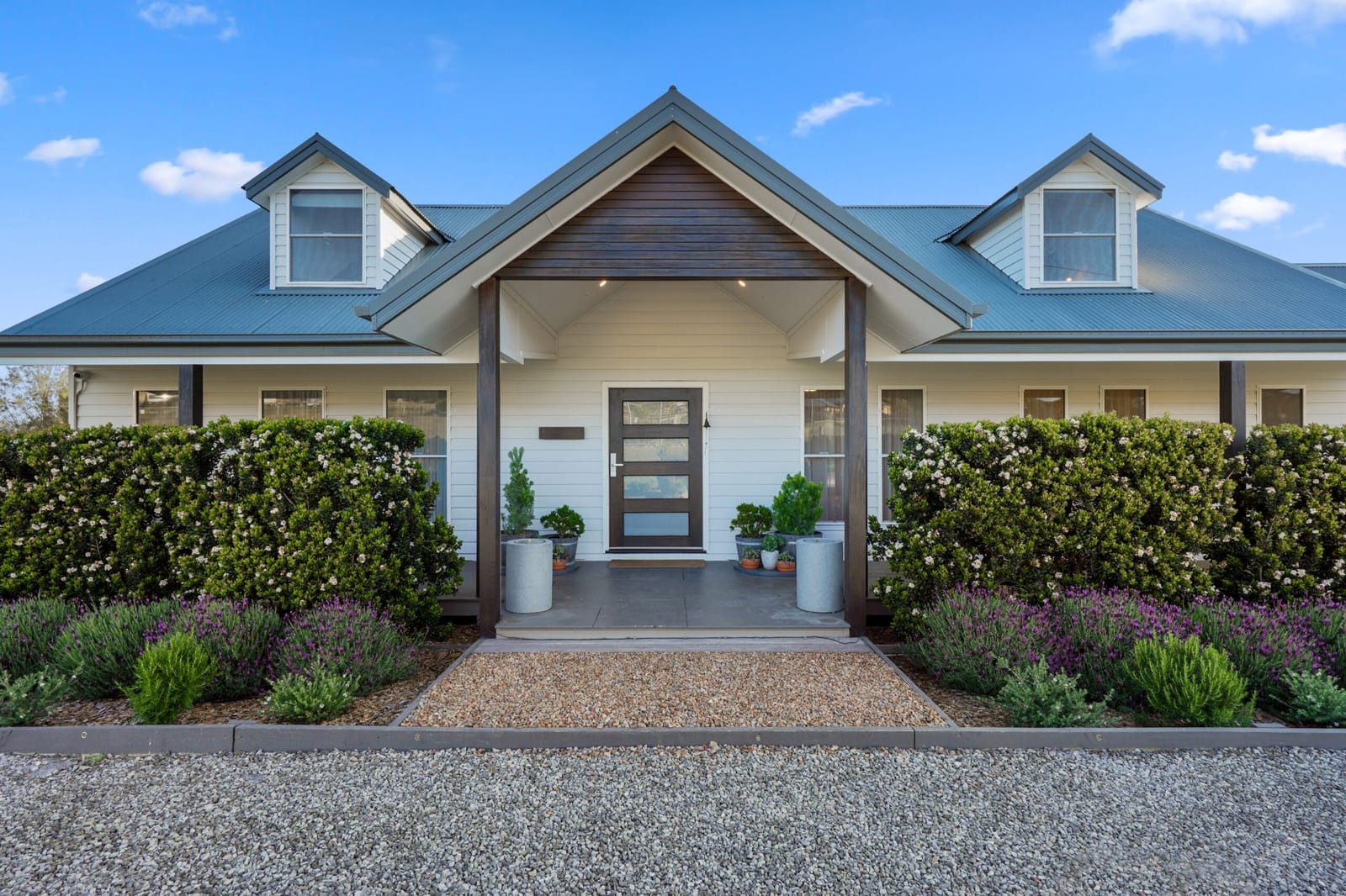 House front behind clipped hedges at Millfield Waters, Millfield, Hunter Valley