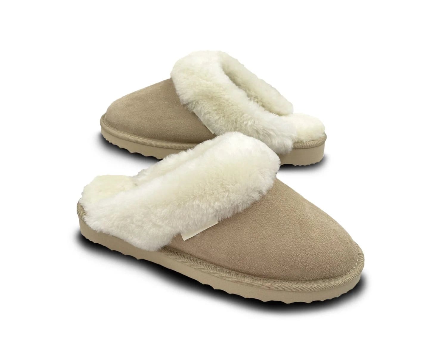 Pair of beige sheepskin slippers with cream fleece lining
