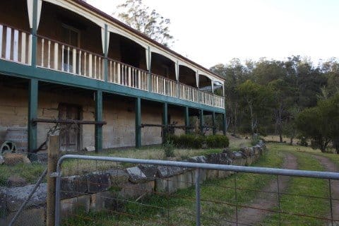 Elevated timber homestead with wraparound verandah at Mulla Villa Farm, Wollombi