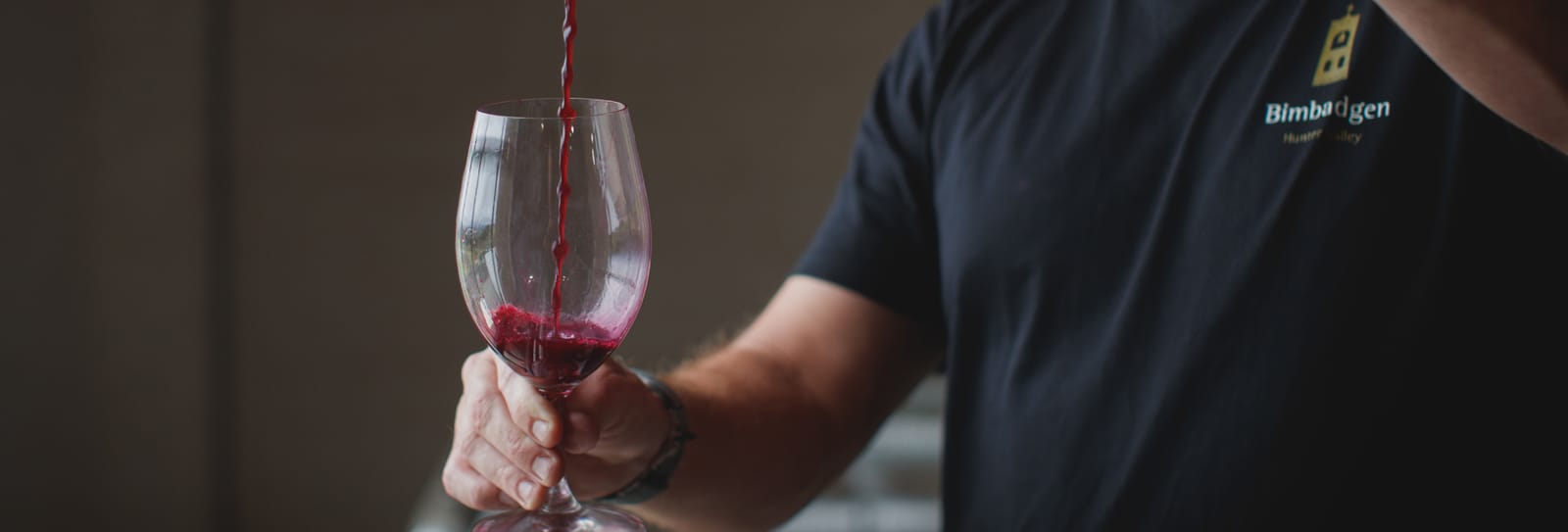 Bimbadgen staff member pouring wine during a tasting experience
