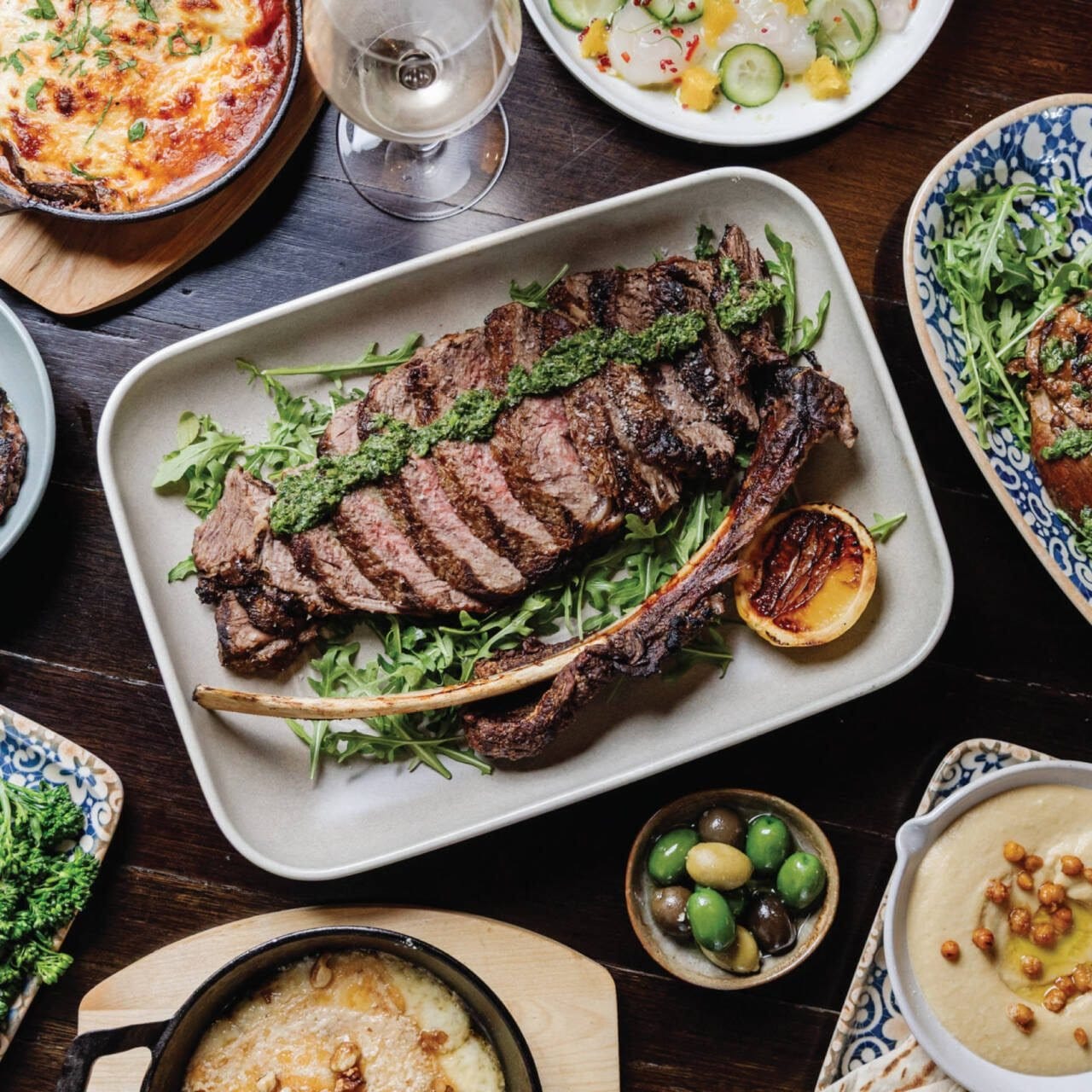 Fine dining plate with grilled meat, vegetables and wine pairing