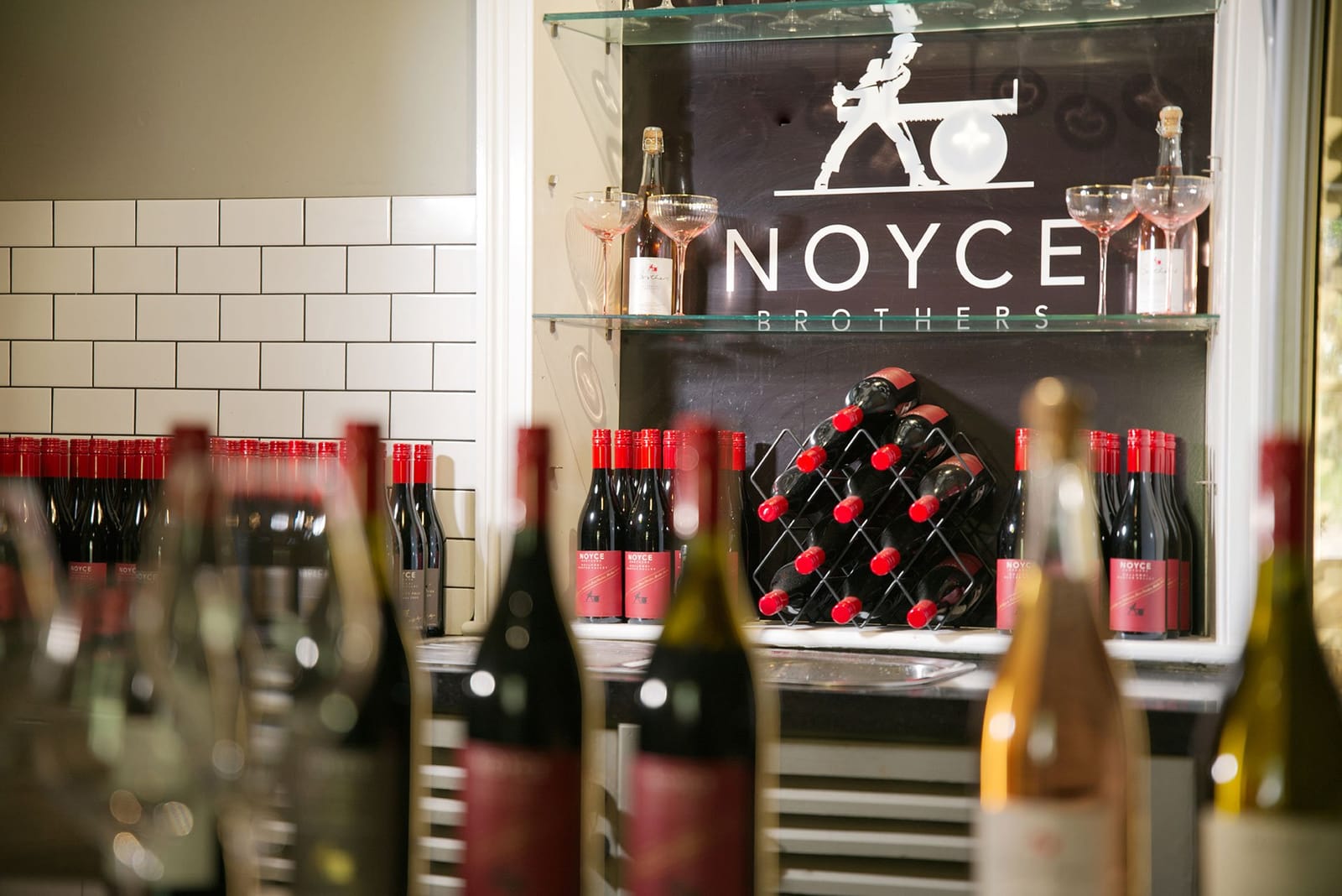 Cellar door display with wine bottles and decanter at Noyce Brothers, Wollombi, Hunter Valley
