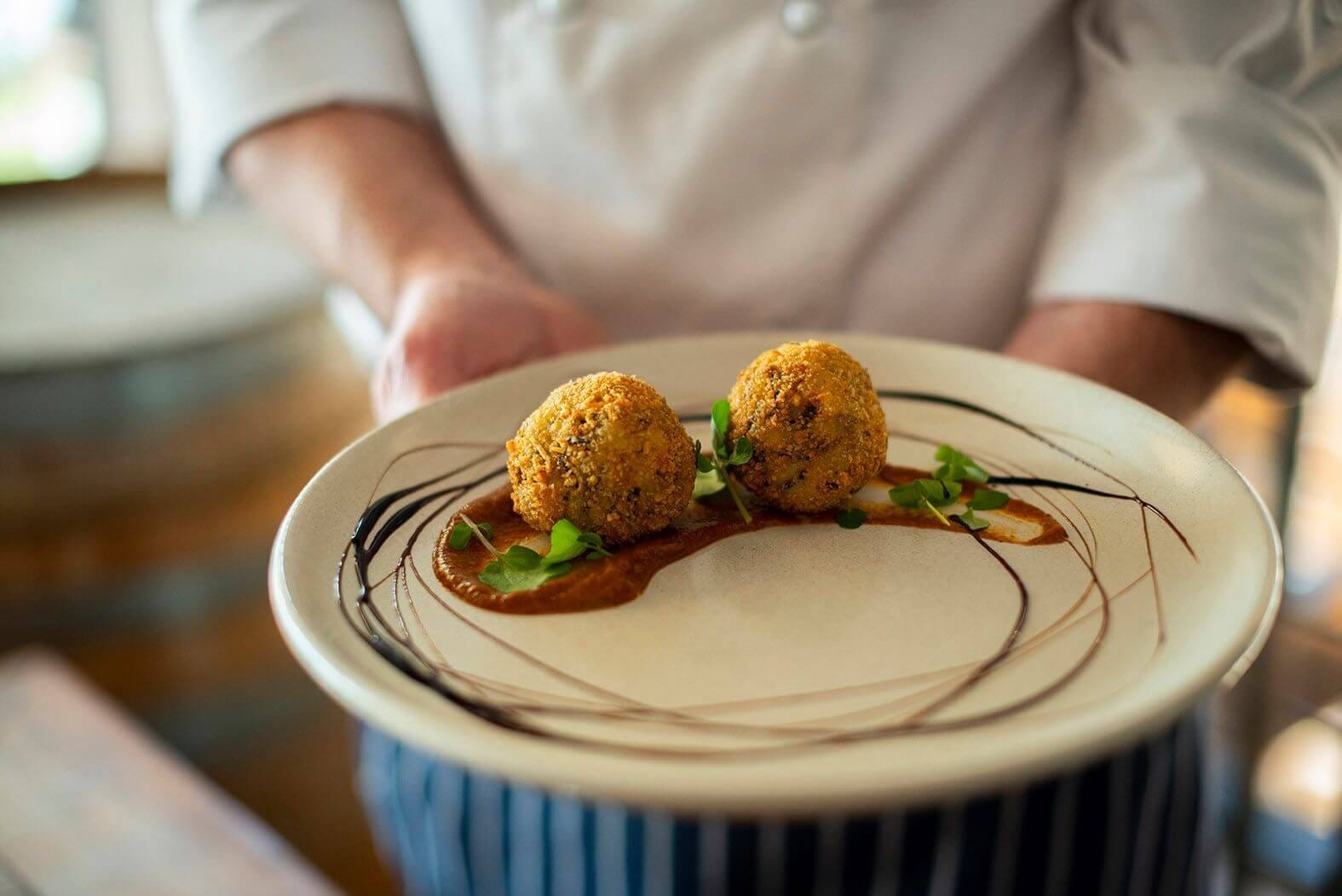 Fine dining plate with croquettes and sauce at Oak and Vine Cypress Lakes, Pokolbin, Hunter Valley