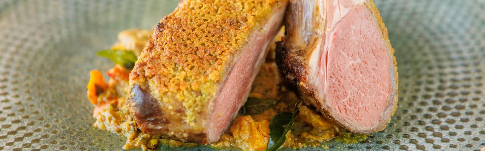 Sliced spice crusted lamb rack plated at Oak and Vine Cypress Lakes, Pokolbin, Hunter Valley
