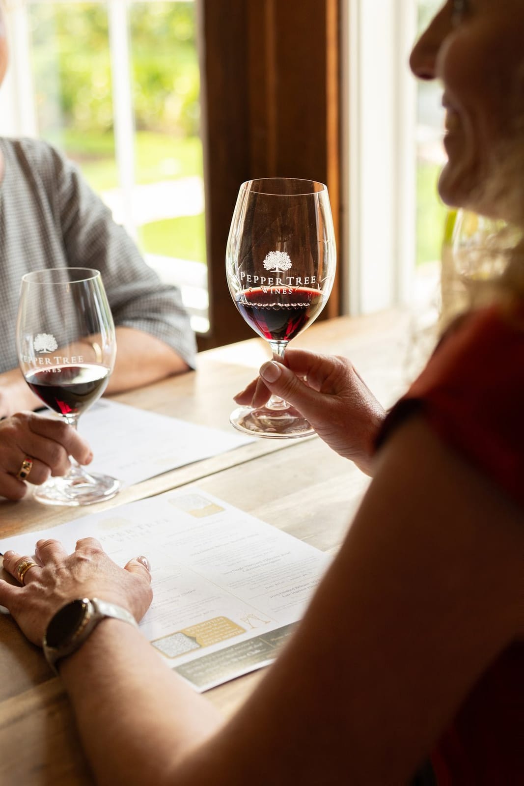 Guests tasting red wine at the Pepper Tree cellar door