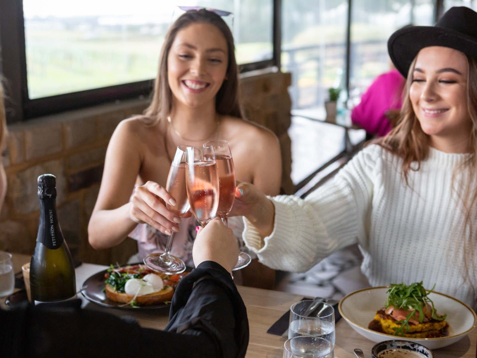 Guests toasting with sparkling wine at an upscale dining table