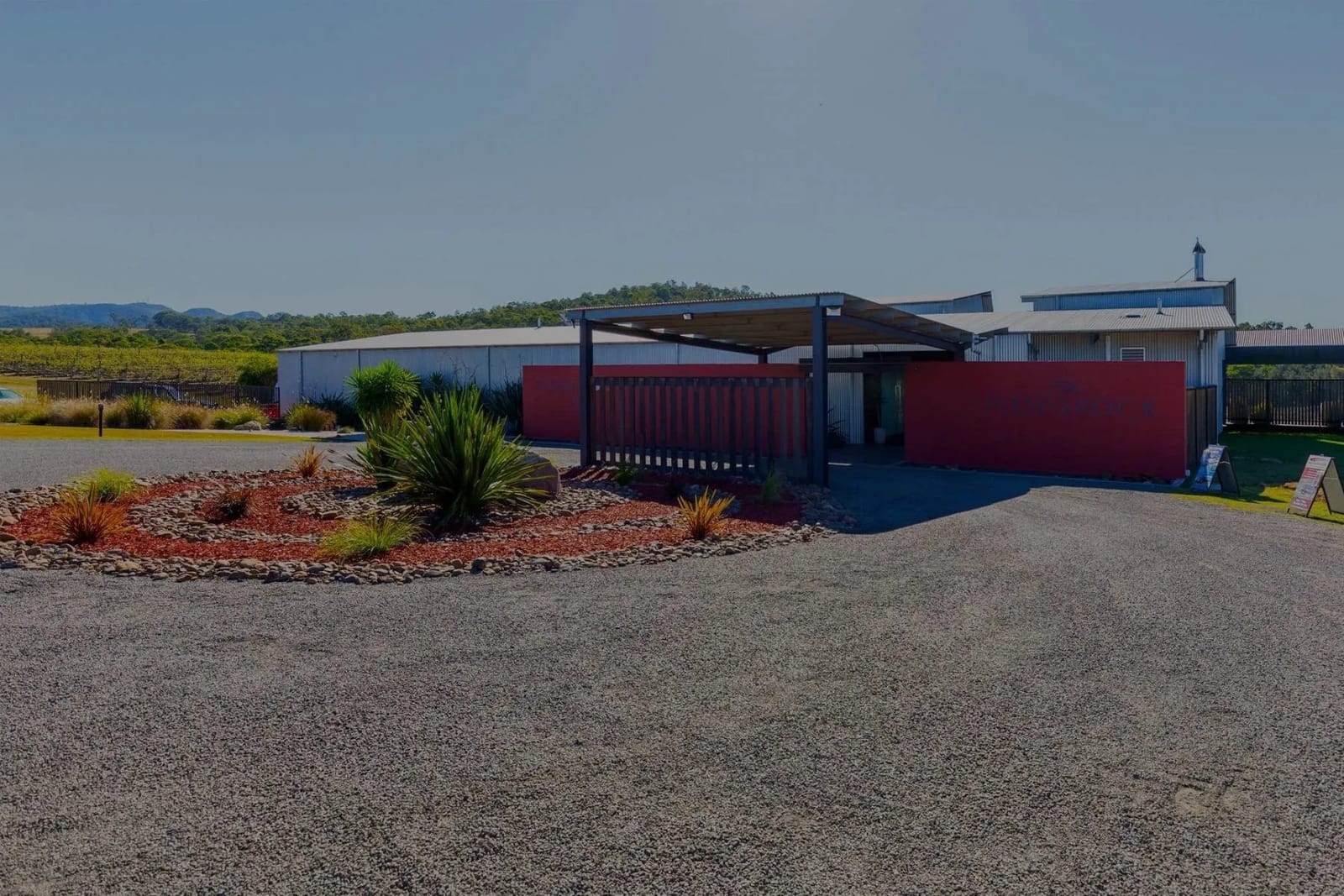 Contemporary cellar door building with red panel design