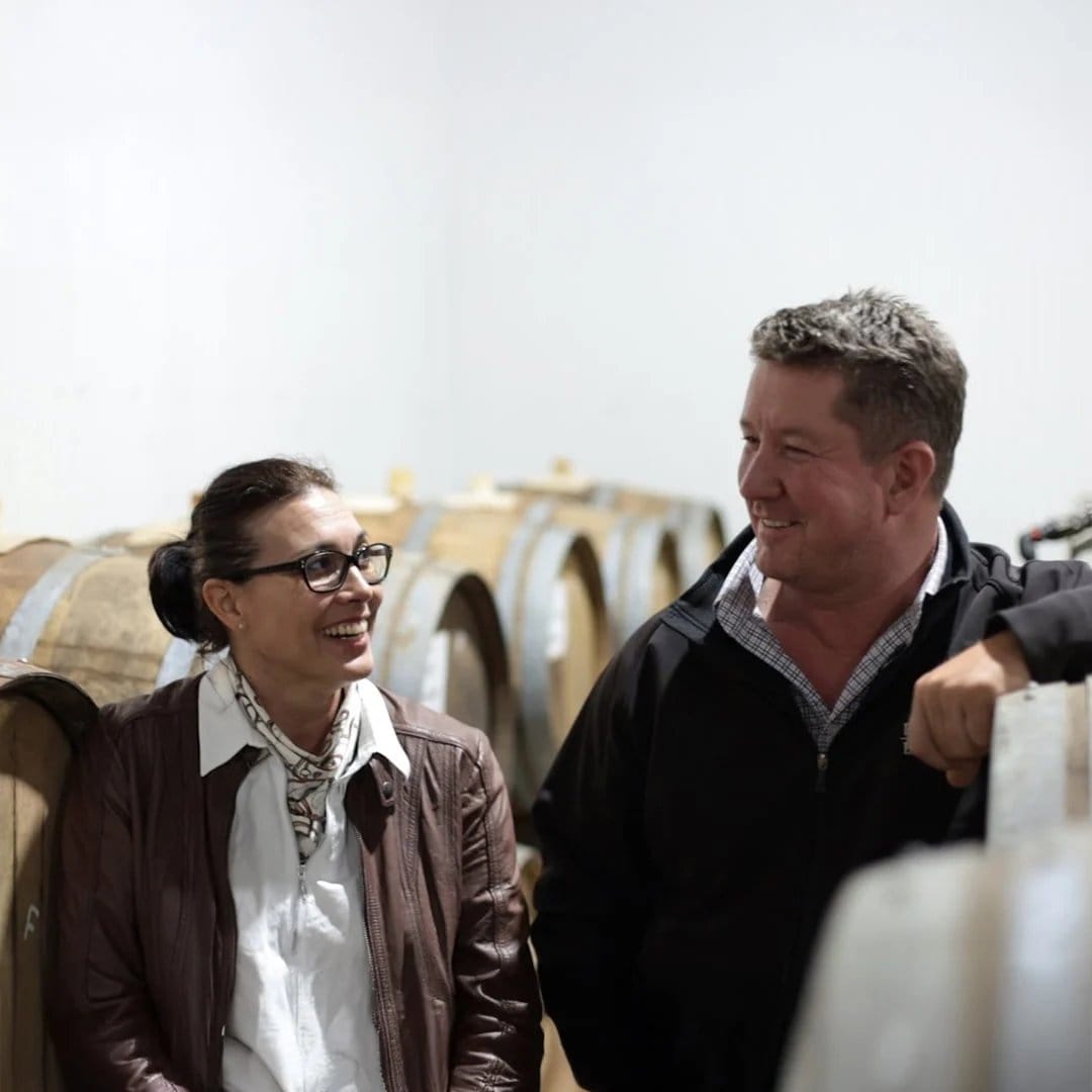 The Pukara Estate owners talking beside barrels