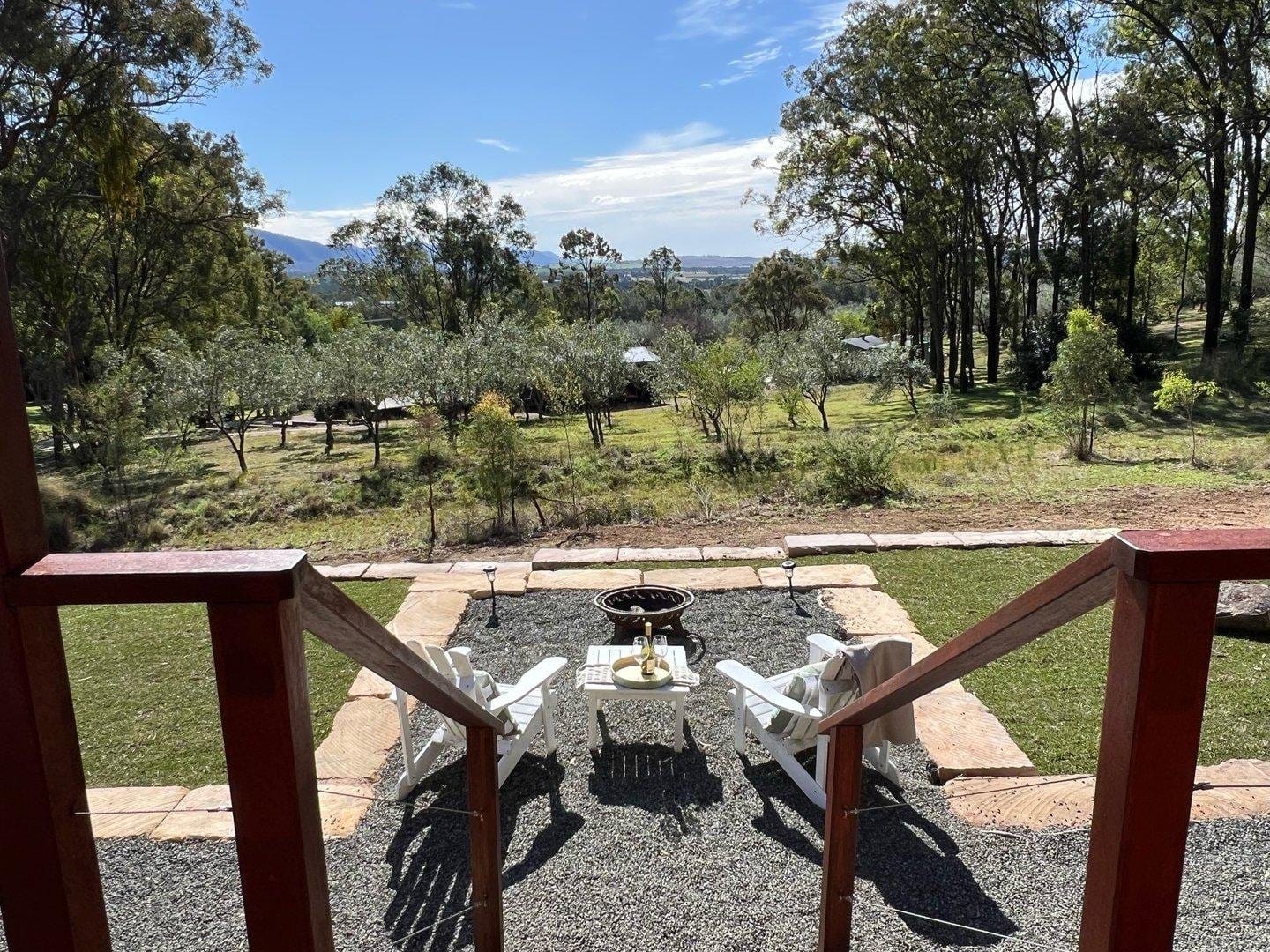 View from the verandah across grazing paddocks to the ridge beyond